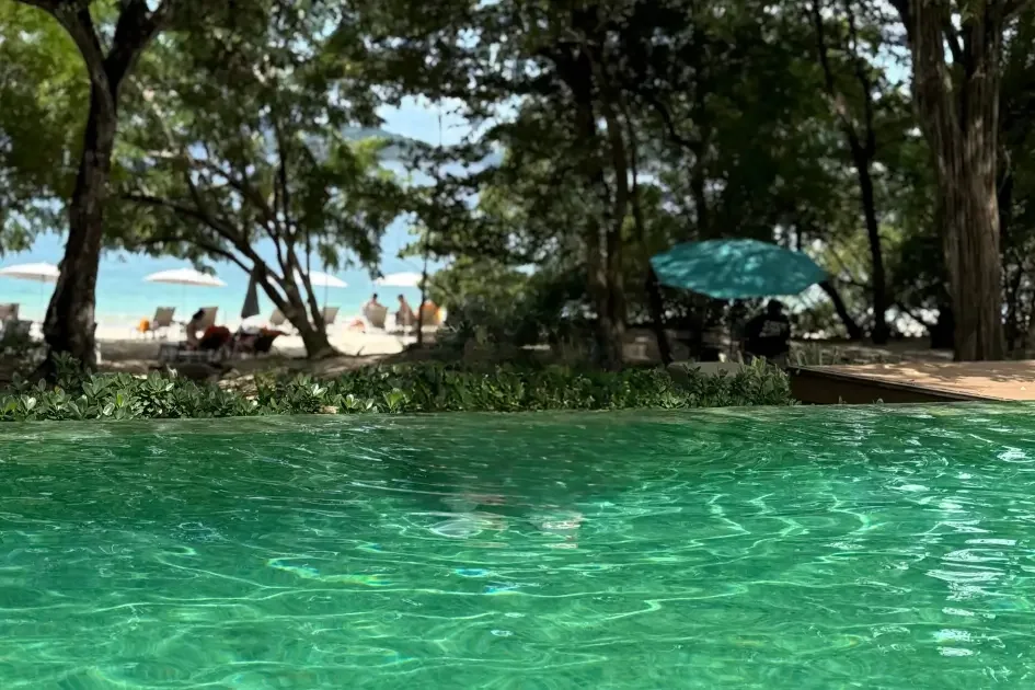Blue-tiled family pool at W Costa Rica overlooking Playa Conchal beach