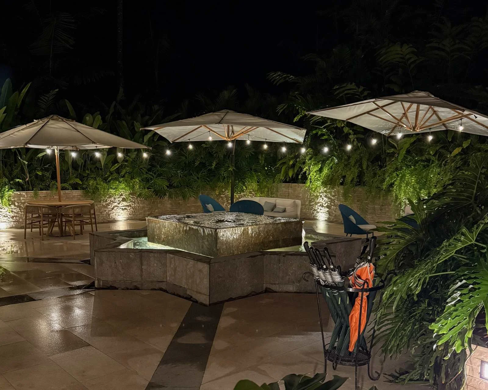 La Terraza restaurant outdoor dining patio with illuminated fountain at Nayara Gardens Costa Rica
