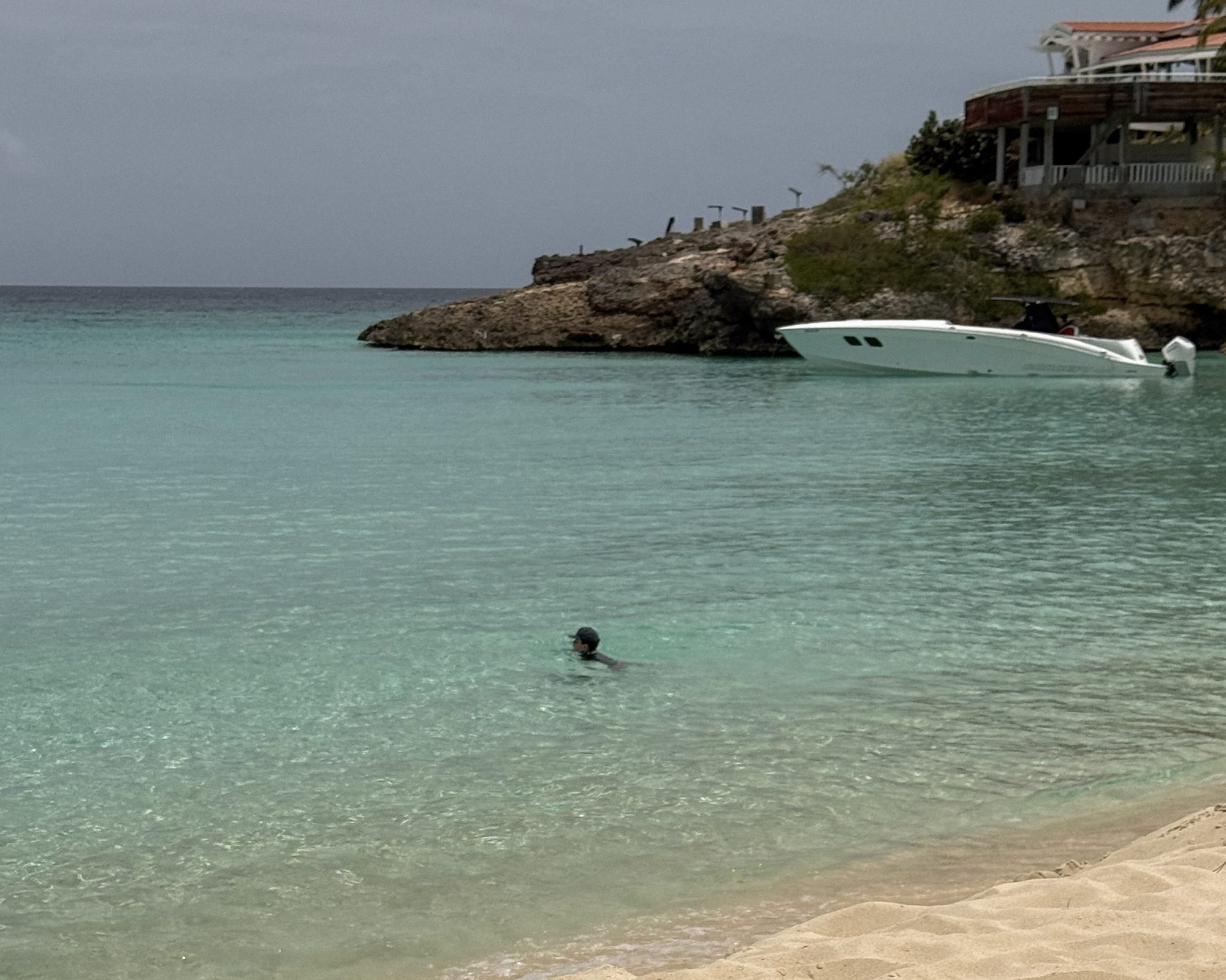 Meads Bay beach and clear turquoise water with Malliouhana on the bluff, Anguilla