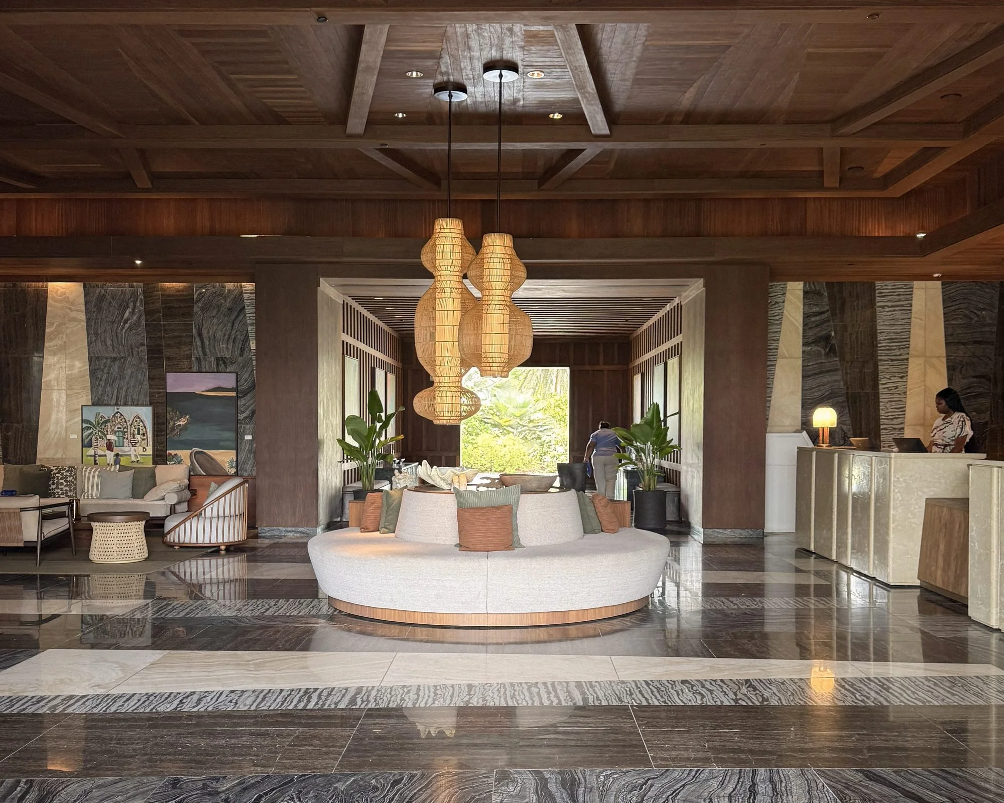 Four Seasons Anguilla lobby with round sofa and woven pendant lights