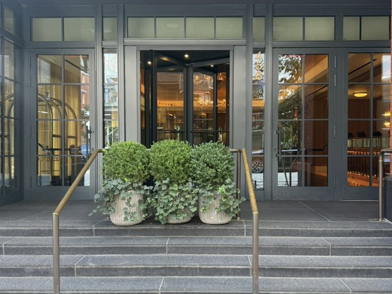 Greenwich Street entrance and stone steps of Fouquet's New York luxury hotel in Tribeca