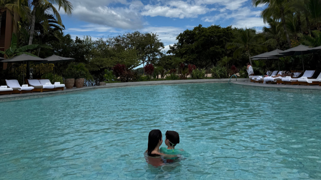Woman and child at the pool at Four Seasons Resort Costa Rica on Peninsula Papagayo.