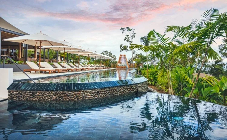 Nayara Tented Camp infinity pool overlooking jungle canopy in Arenal, Costa Rica