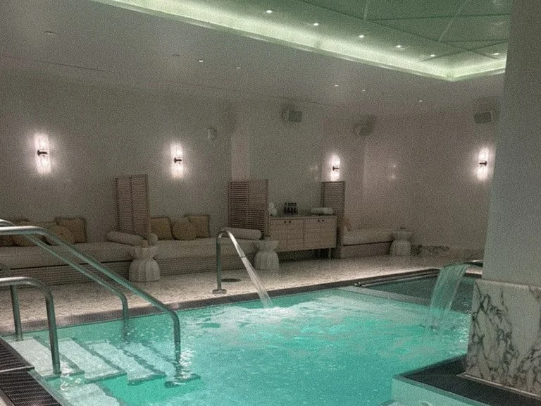 Subterranean indoor hydrotherapy pool with marble walls at Spa Fouquet's New York in Tribeca
