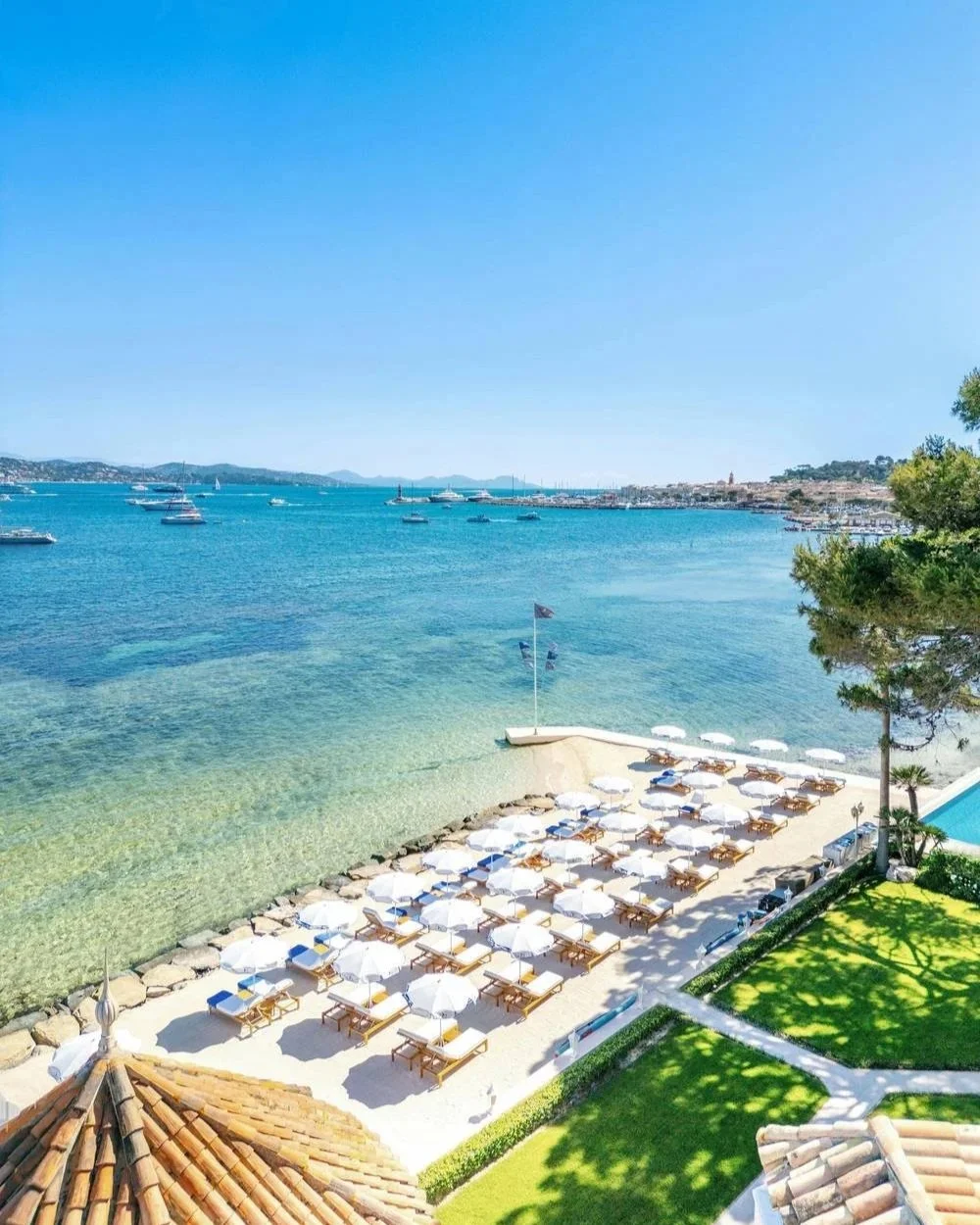 Loungers and umbrellas on the private beach at Cheval Blanc St-Tropez, Plage de la Bouillabaisse
