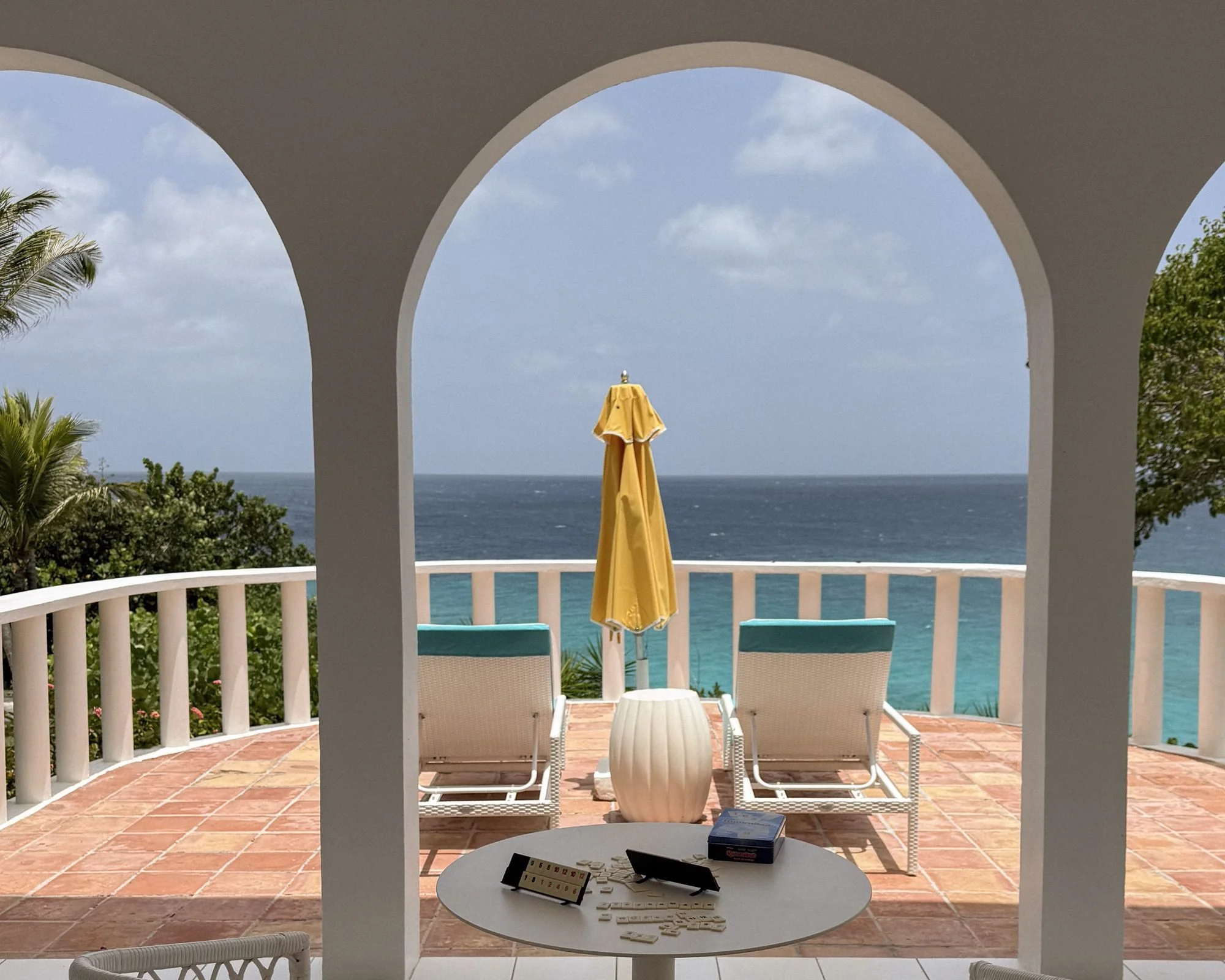 Guest room terrace with ocean view and Rummikub game at Malliouhana Anguilla