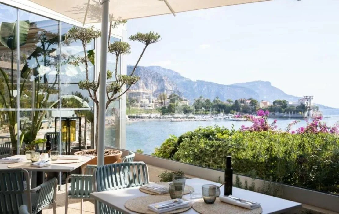 Terrace tables overlooking the bay and Villa Kérylos at Royal-Riviera, Saint-Jean-Cap-Ferrat
