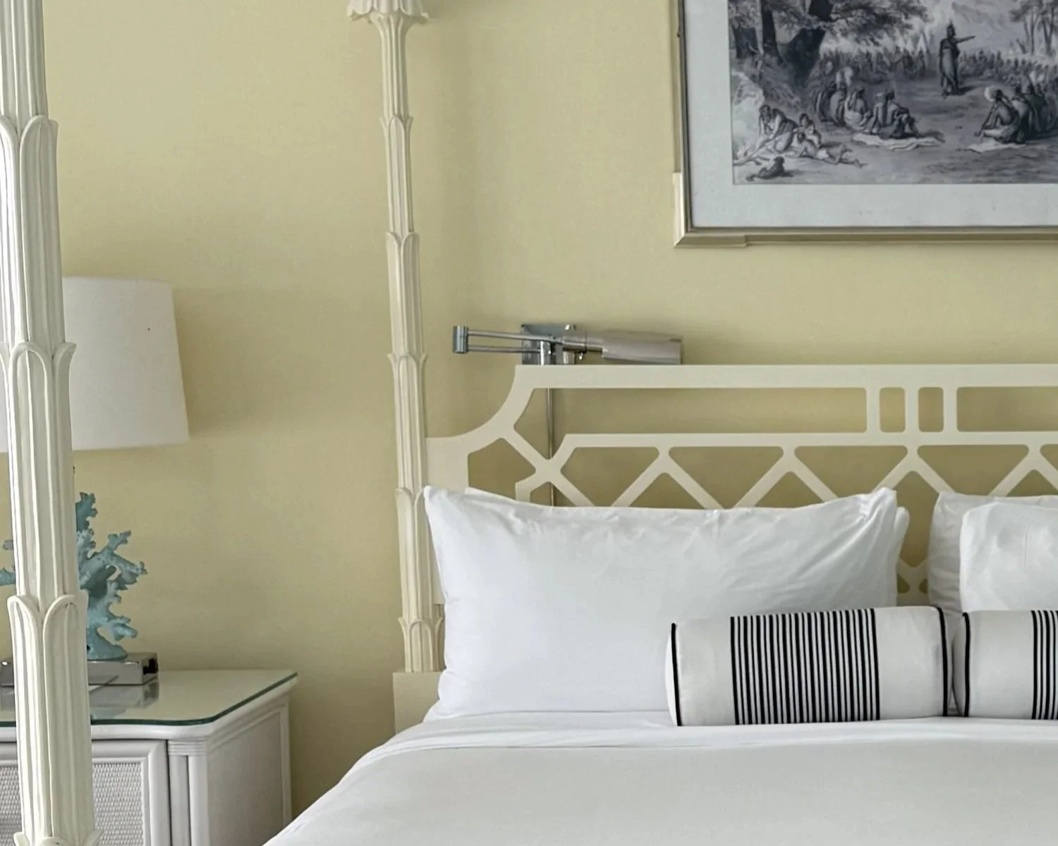 Close up of a carved wooden four-poster bed in a guest room at Malliouhana Anguilla