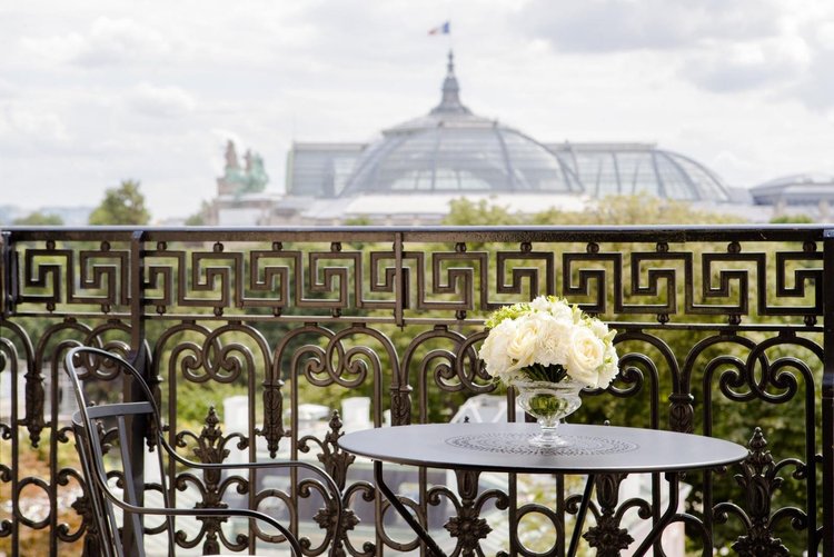 La Reserve Paris balcony view toward Grand Palais, intimate luxury palace hotel