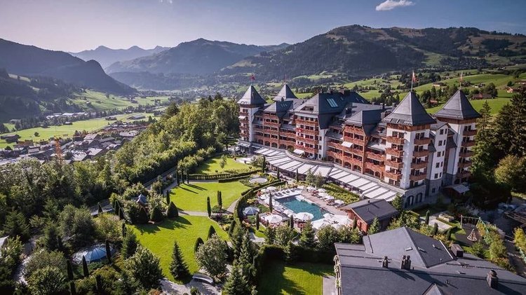 The Alpina Gstaad aerial summer view with mountains