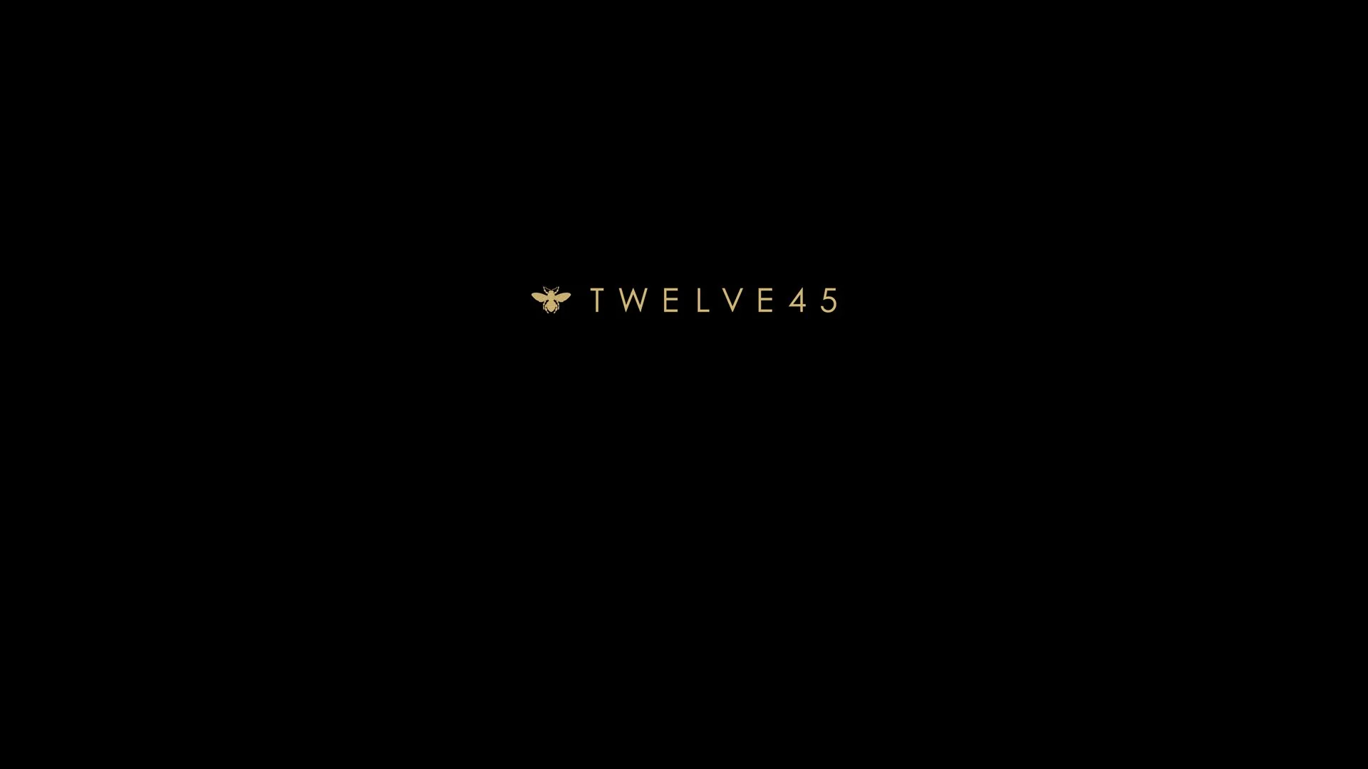 Black background with a small gold bee icon and the text 'TWELVE45' in gold at the center.