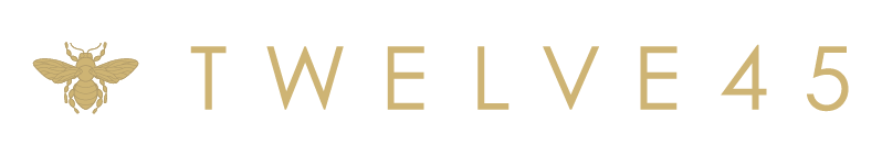 Logo featuring a gold bee icon followed by the text 'TWELVE45' in gold uppercase letters.