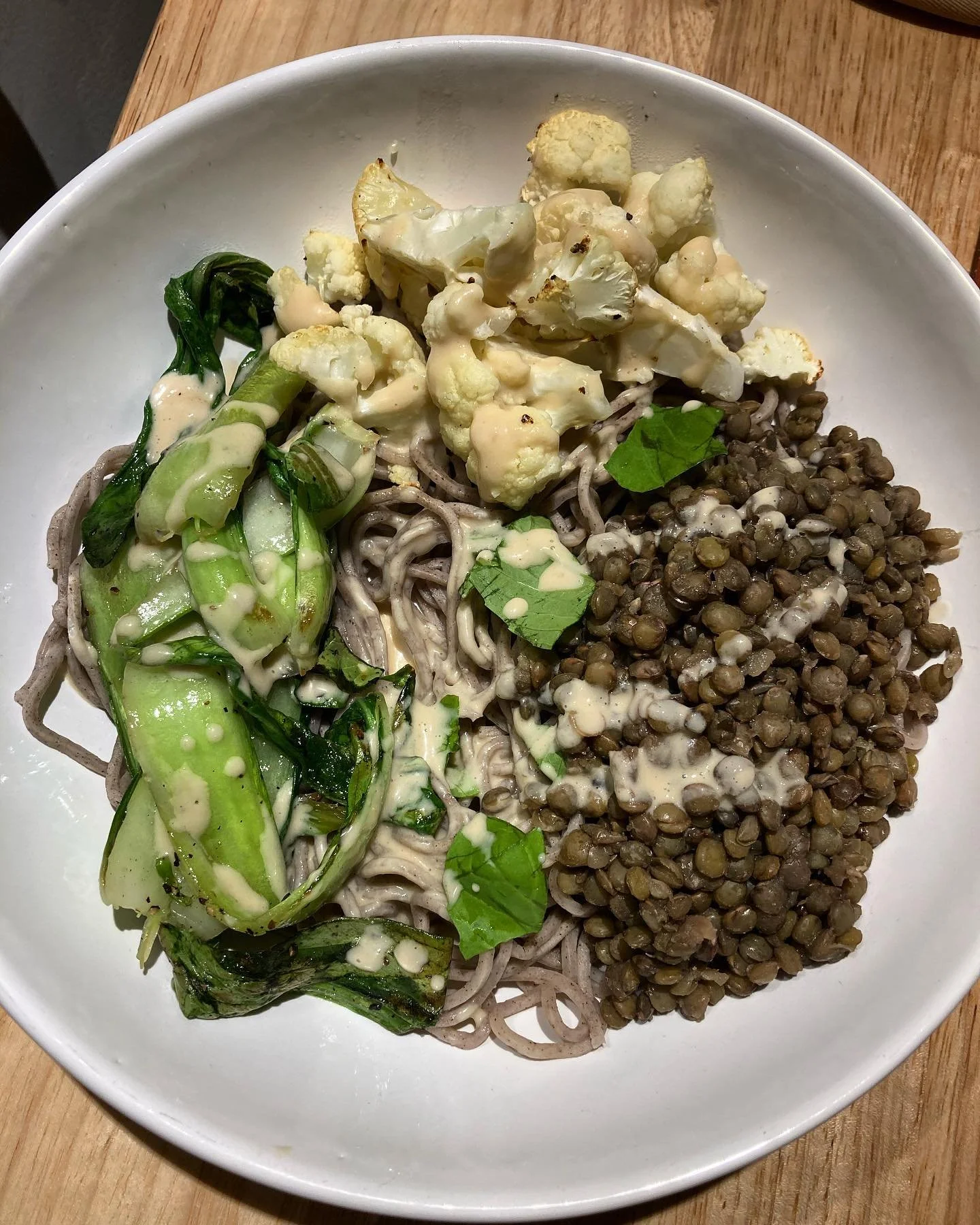 Buckwheat soba noodles 
Green (French) lentils 
Roasted cauliflower 
Saut&eacute;ed bok choy
Tahini garlic sauce