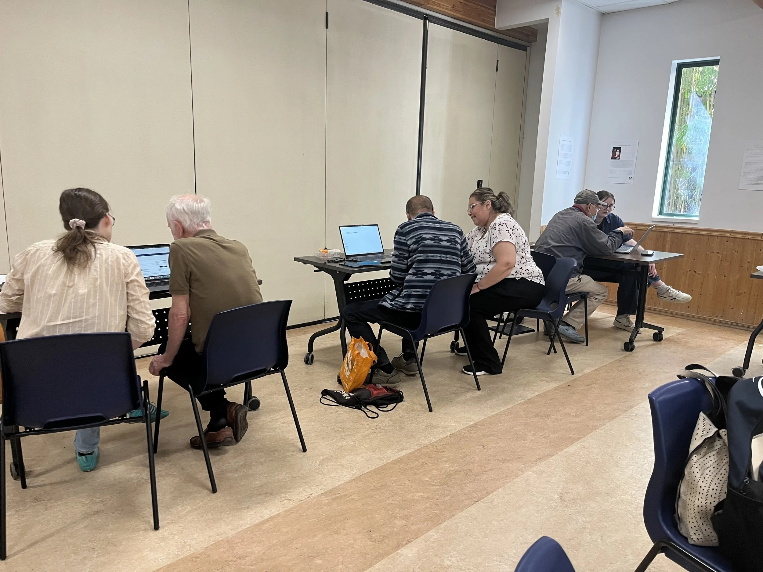 Ruth at Tech Cafe helping a senior