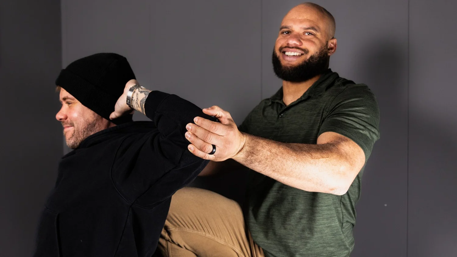 A practitioner assisting a client through a stretch