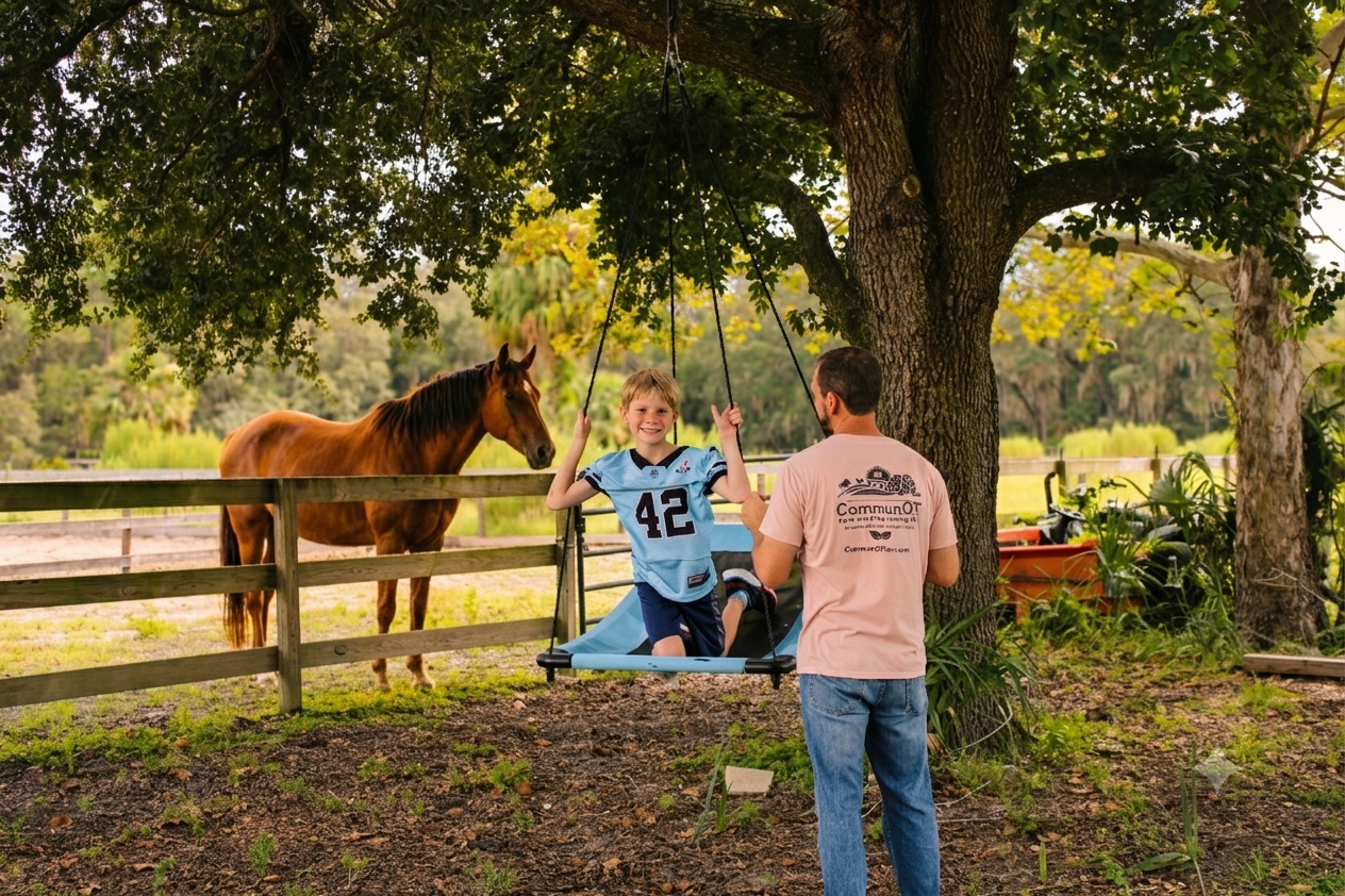 Boy on Swing with Occupational Therapist standing by. Horse in Pasture watching