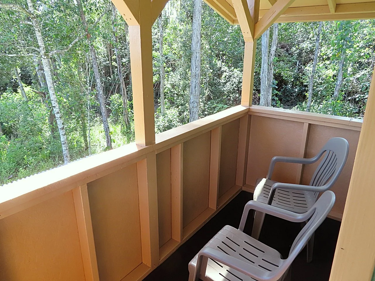 Upstairs lanai, just off the bedroom, looking out into the Ohia forest. Relax, read, meditate, do some yoga.