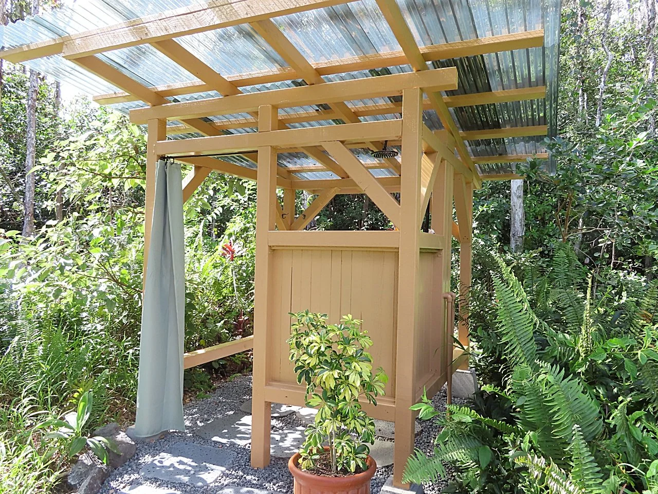 Nice, hot, private outdoor shower surrounded by lush foliage.