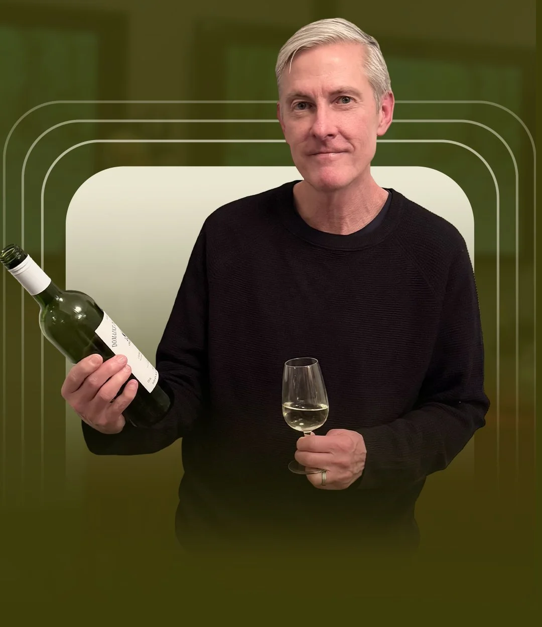 Todd Wernstrom, founder of Urban Pour Tastings in NYC, holding a glass of white wine and bottle during a wine education and tasting experience.