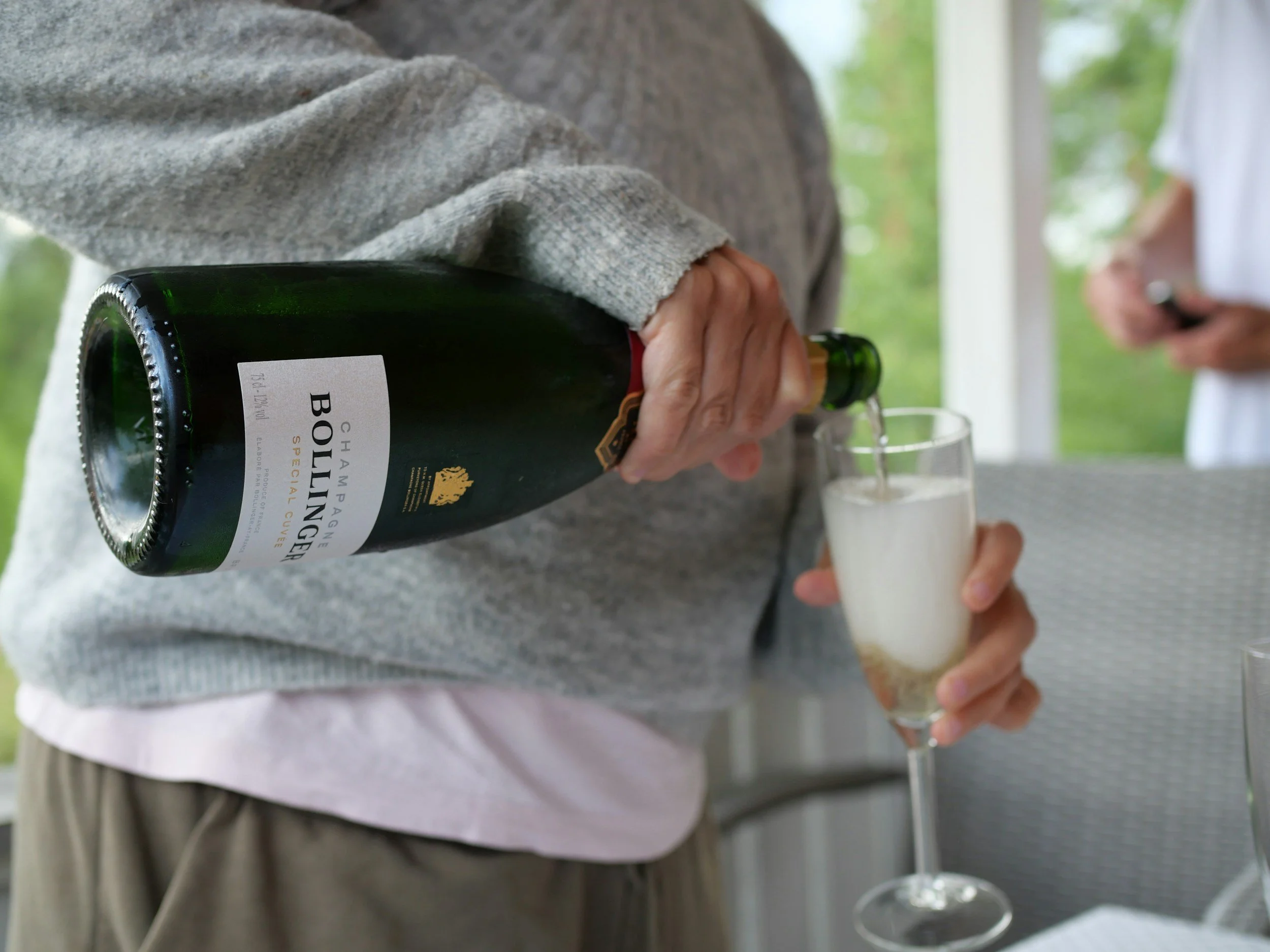 Sparkling wine being poured into a glass during a curated wine tasting experience