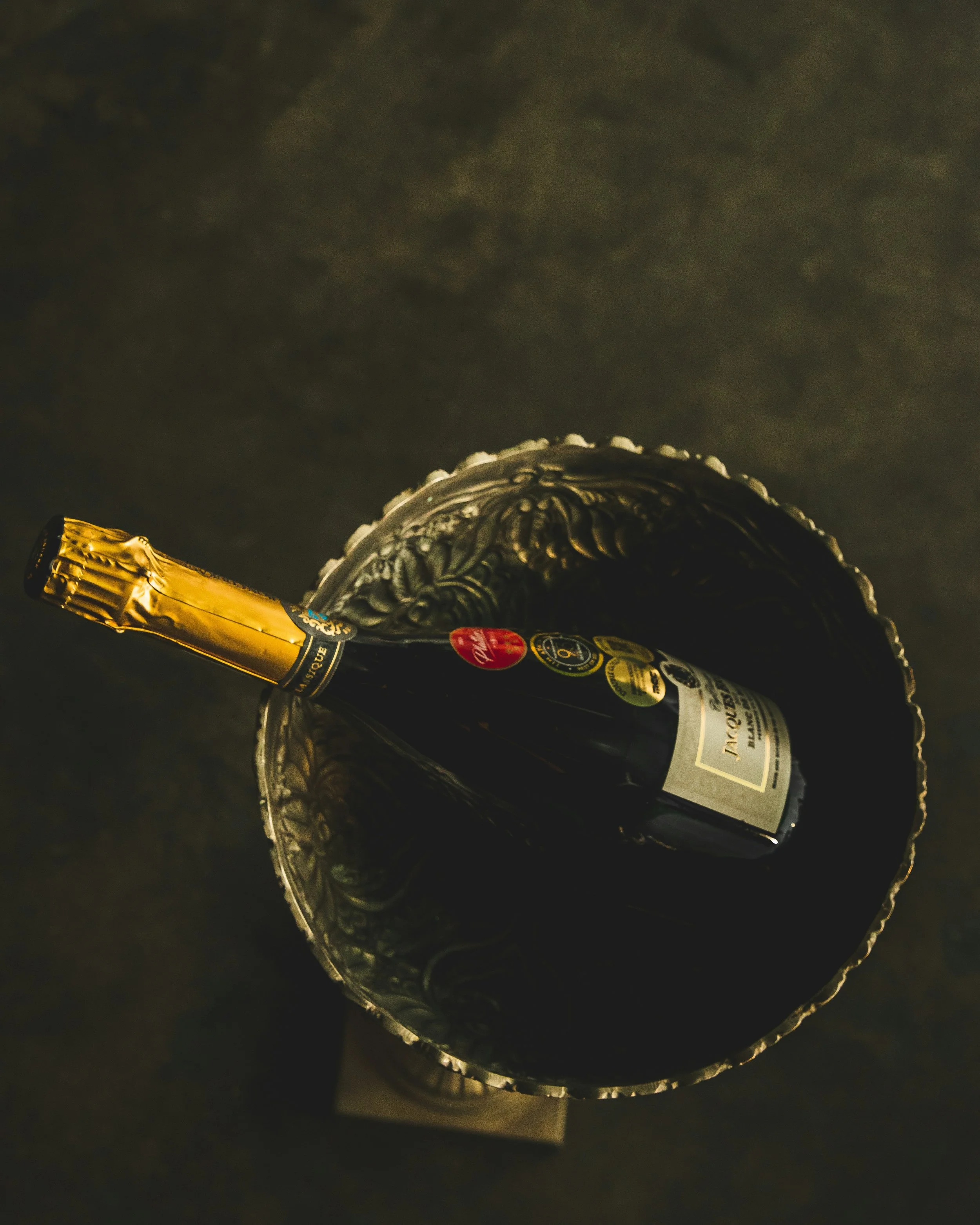 Champagne bottle displayed in an elegant silver ice bucket representing boutique sparkling wine and refined Champagne selections