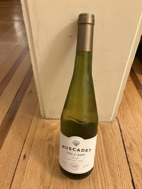 Bottle of Muscadet white wine from the Loire Valley featured as a crisp summer wine option