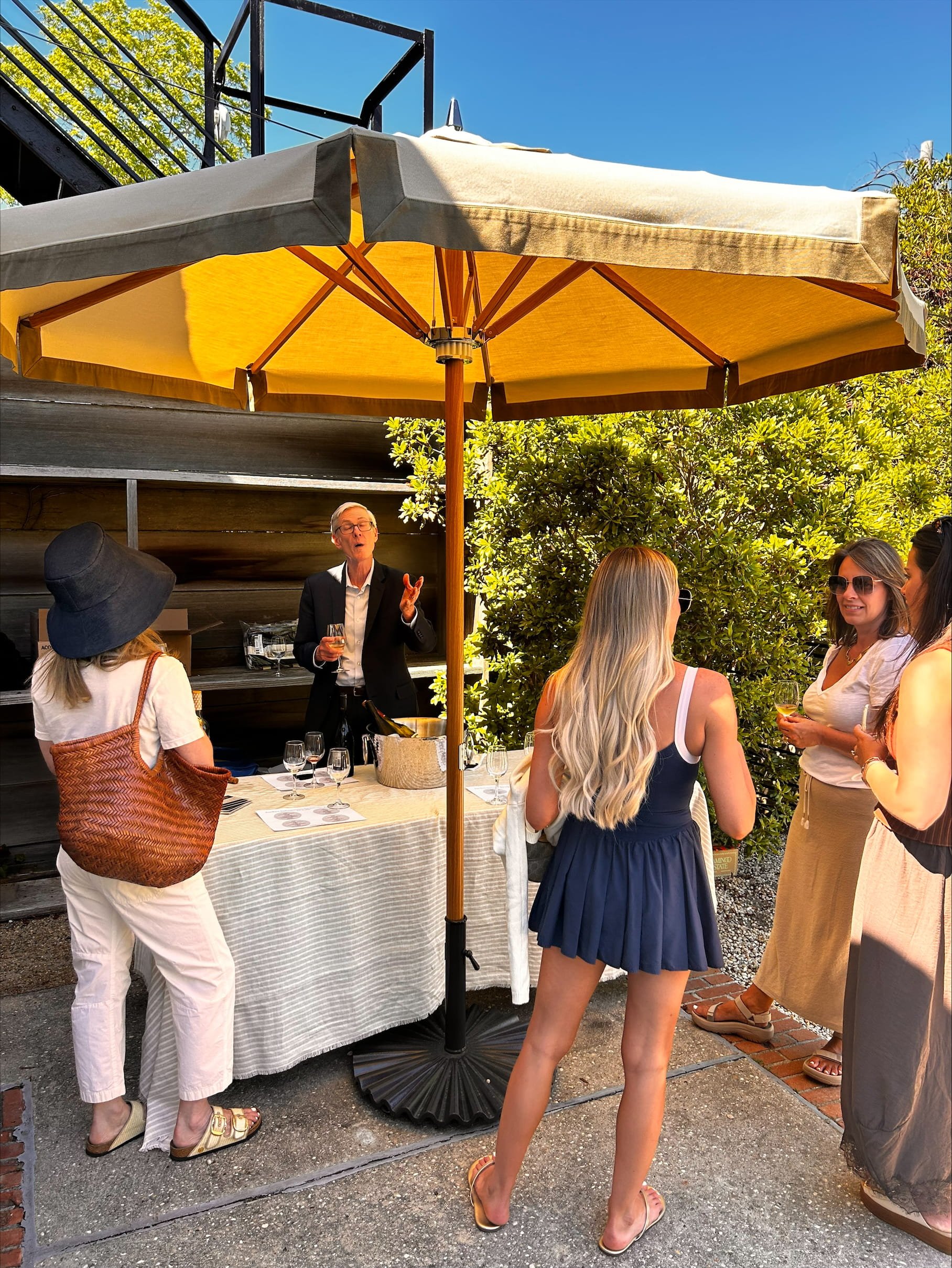 Guests enjoying a private wine tasting hosted by Urban Pour Tastings during the Jenni Kayne Southampton anniversary celebration.