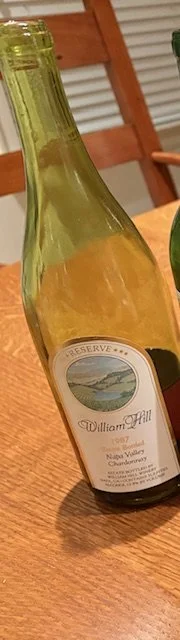 Bottle of aged Chardonnay from Napa Valley showing darker color from wine aging