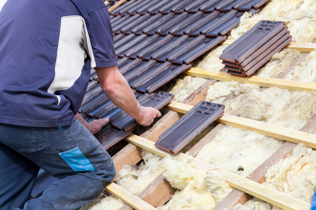 roofer-laying-tile-roof_105413-822.jpg