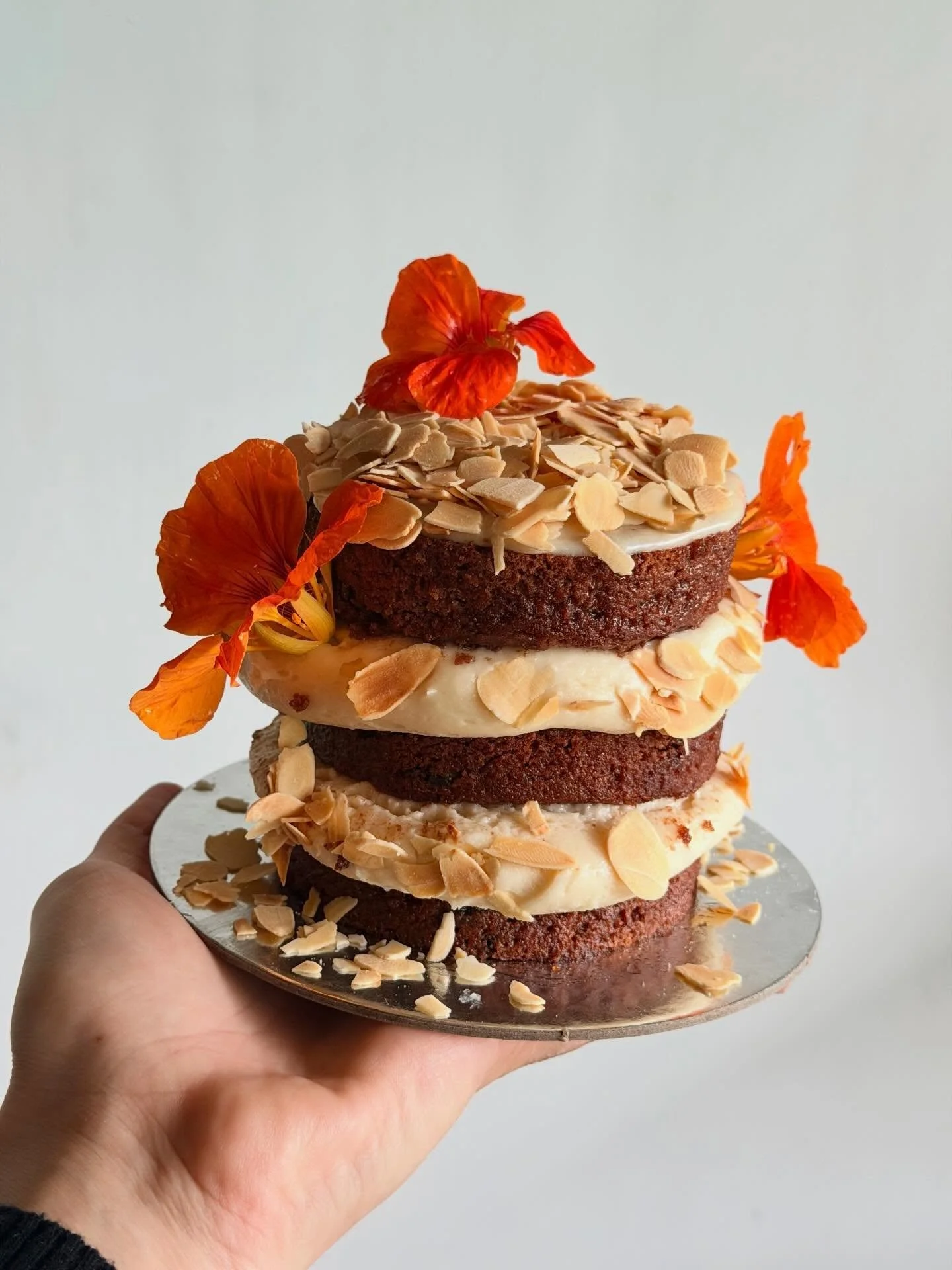 Mini tier cake for a special occasion - Gluten Free chocolate, banana &amp; halva cake with an almond soak &amp; nasturtiums from the garden

DM or visit www.reallygoodglutenfree.com for custom orders Xx