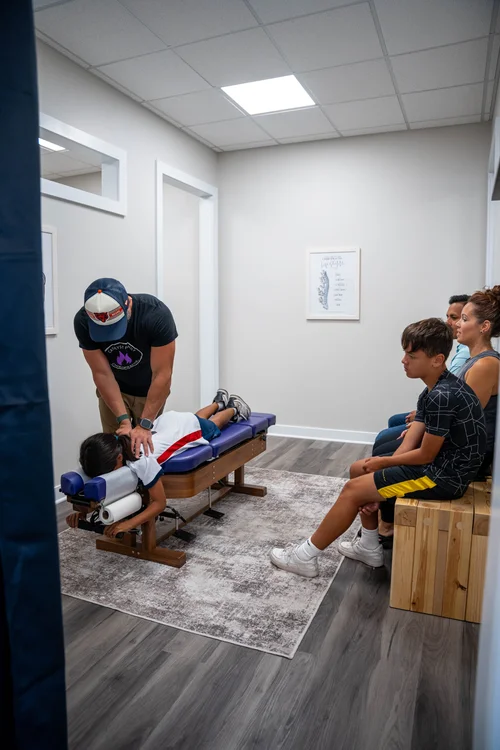Dr. Jeremy Lawson providing family wellness chiropractic care at Catalyst Family Chiropractic in Crystal Lake, IL