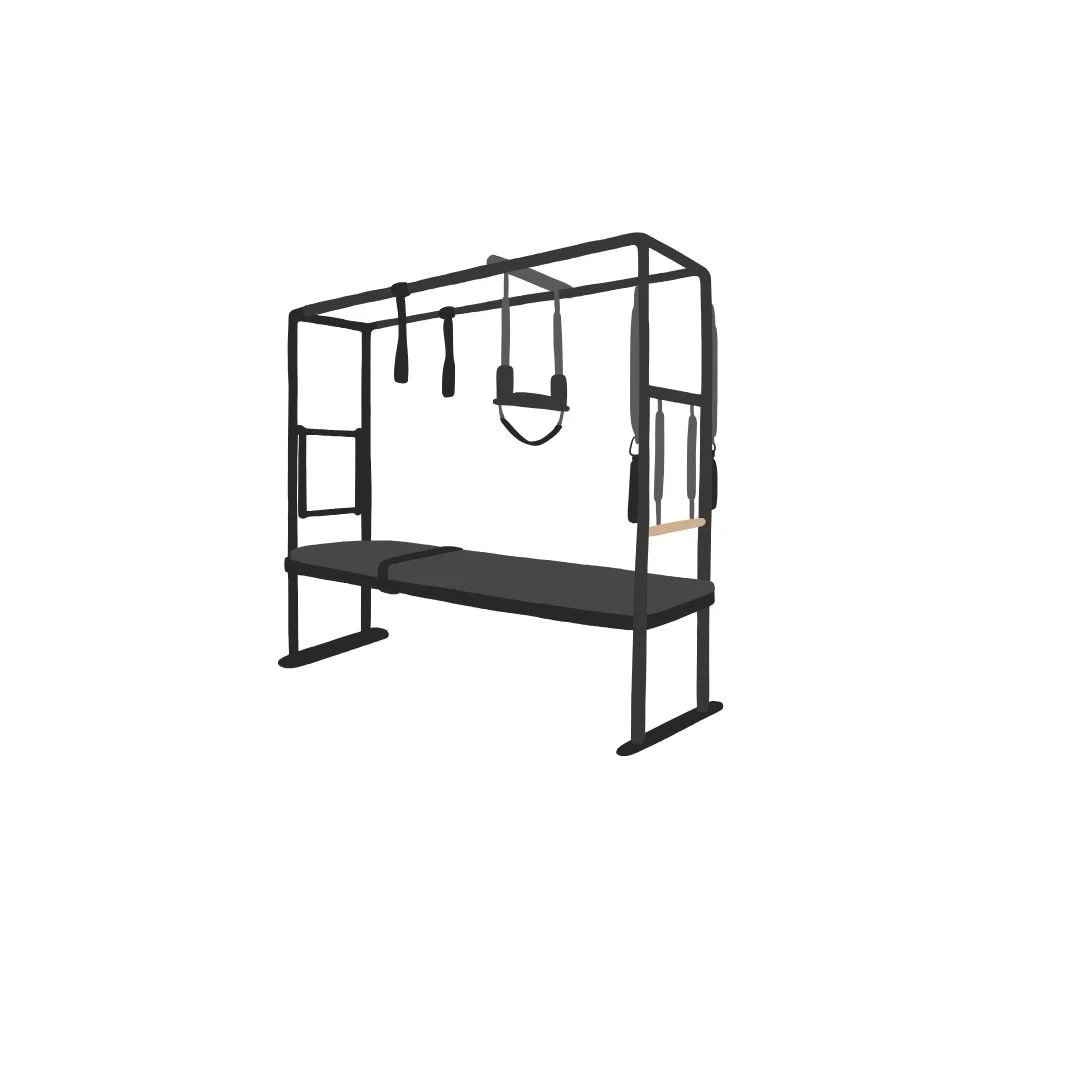 Gymnastic training station with a black padded mat, hanging rings, and suspension straps on a metal frame