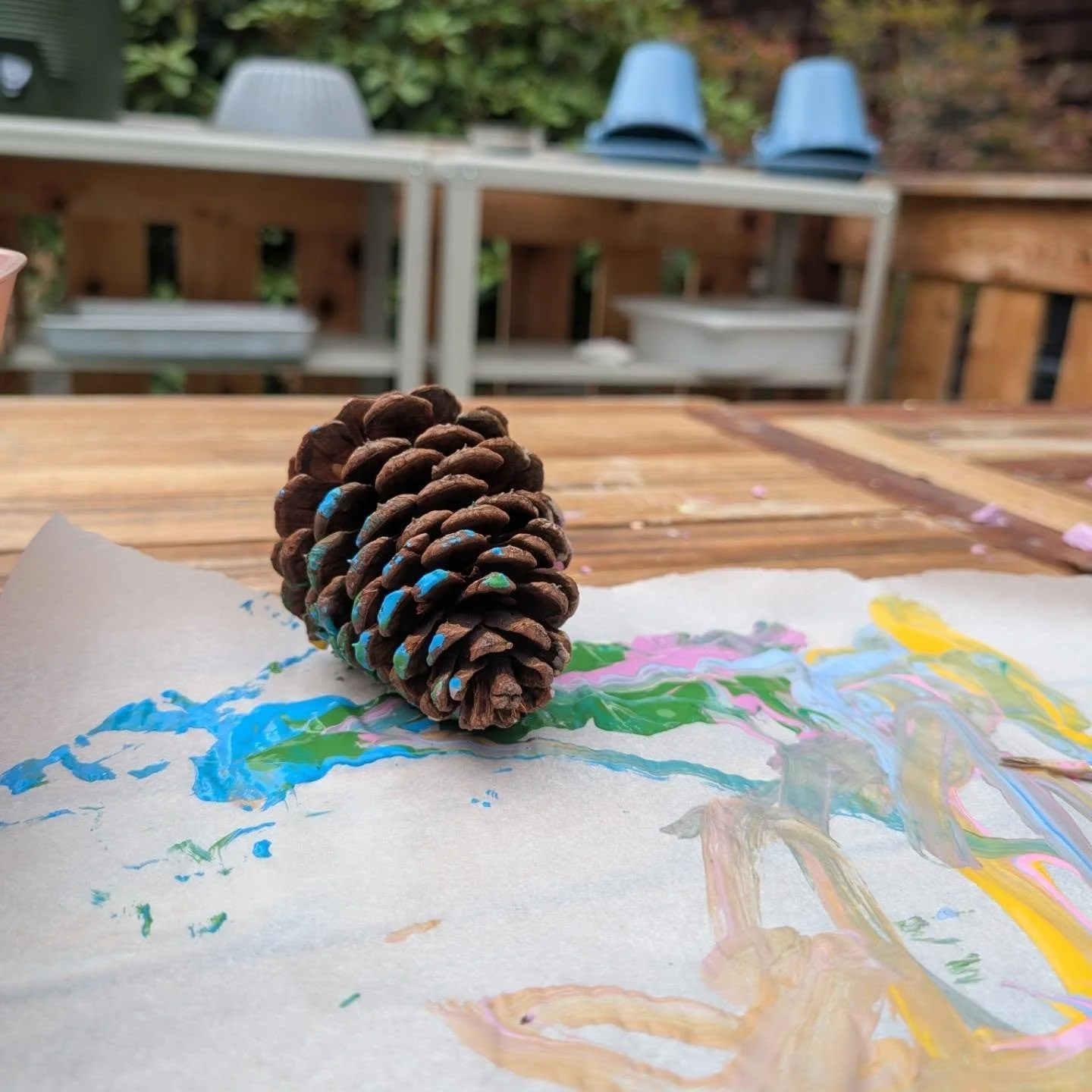 Such a lovely early fall day to be painting pinecones. 💕 I love the time we get to spend with the kids outside doing crafts.
