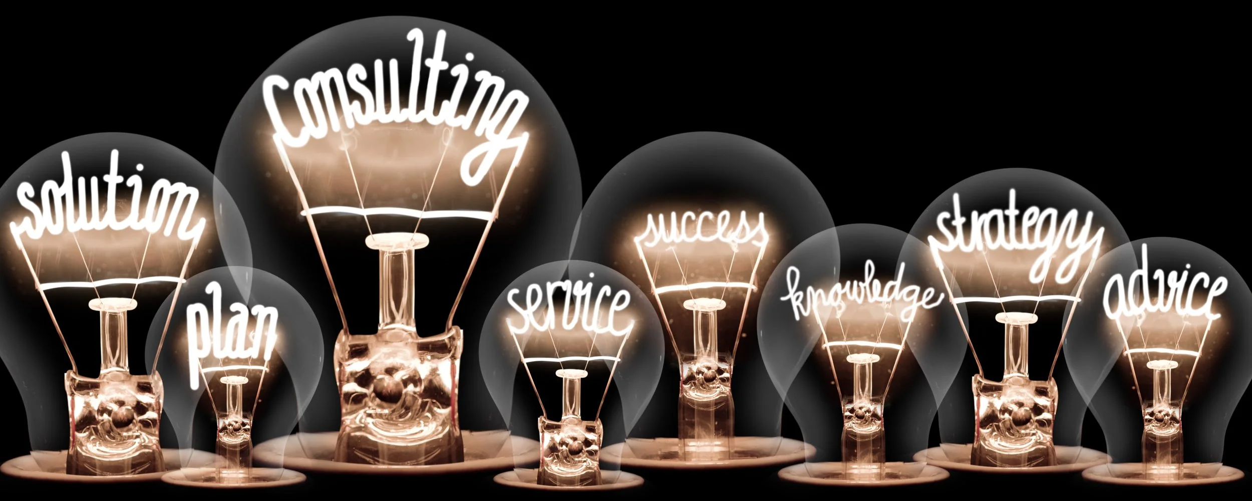 Light bulbs with words: solution, plan, consulting, service, success, knowledge, strategy, advice, and