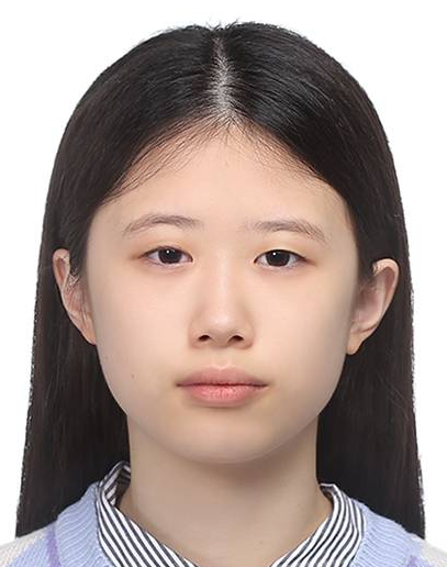 A young woman with long black hair, light skin, and wearing a striped shirt, looking directly at the camera with a neutral expression.