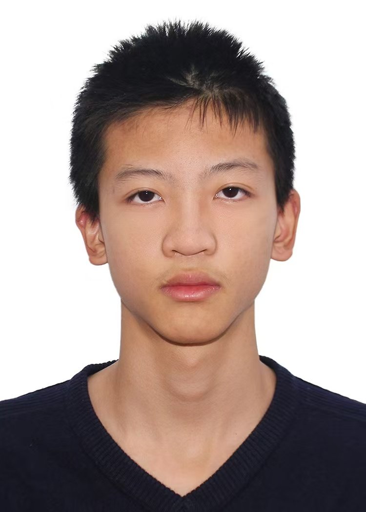A young Asian male with short black hair wearing a dark sweater, looking directly at the camera with a neutral expression.