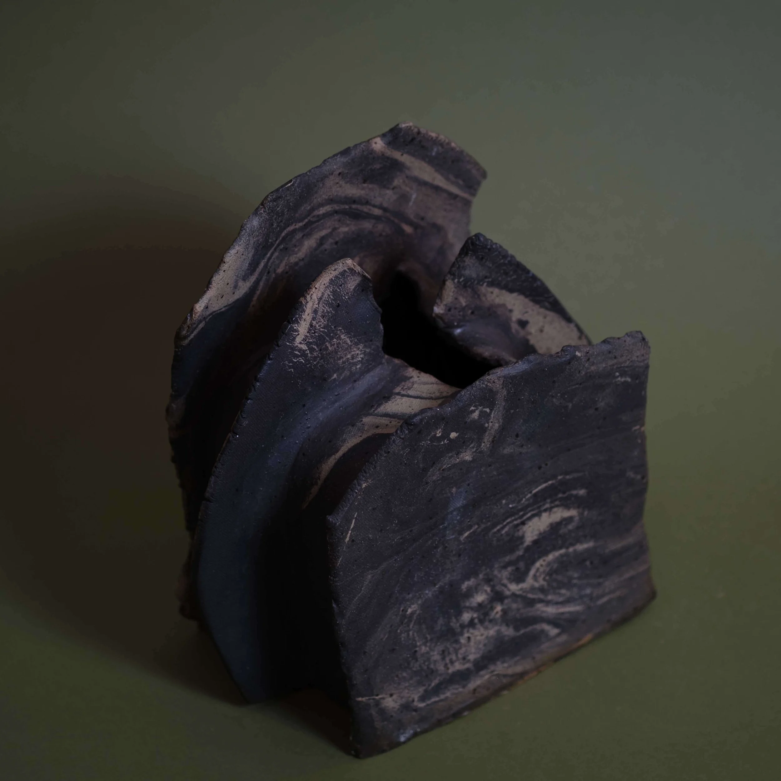 Detail of Mountain Vessel handmade ceramic artwork highlighting carved clay layers and earthy matte finish