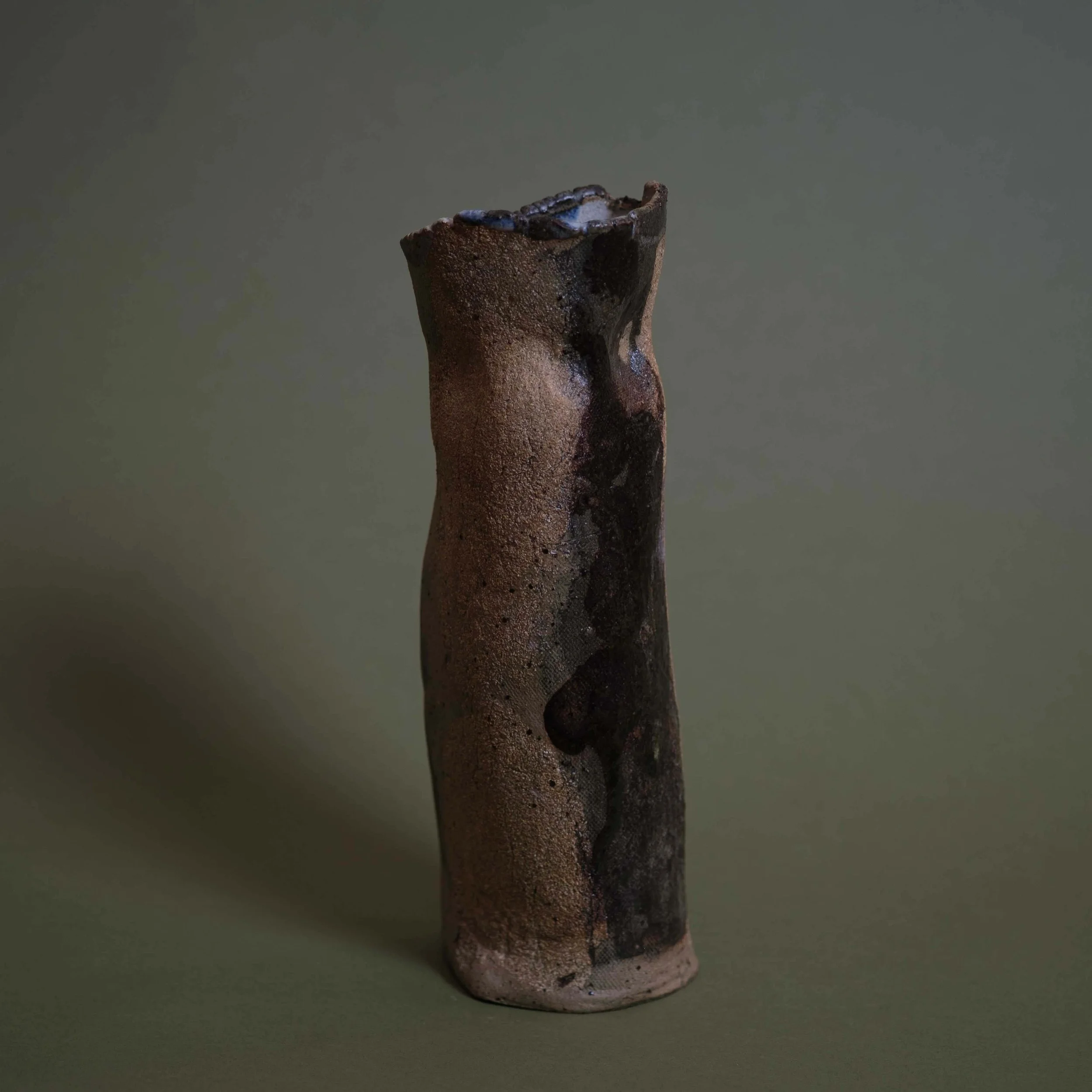 Tall Yellow Vessel contemporary ceramic piece with organic vertical structure and contrasting dark glaze accents