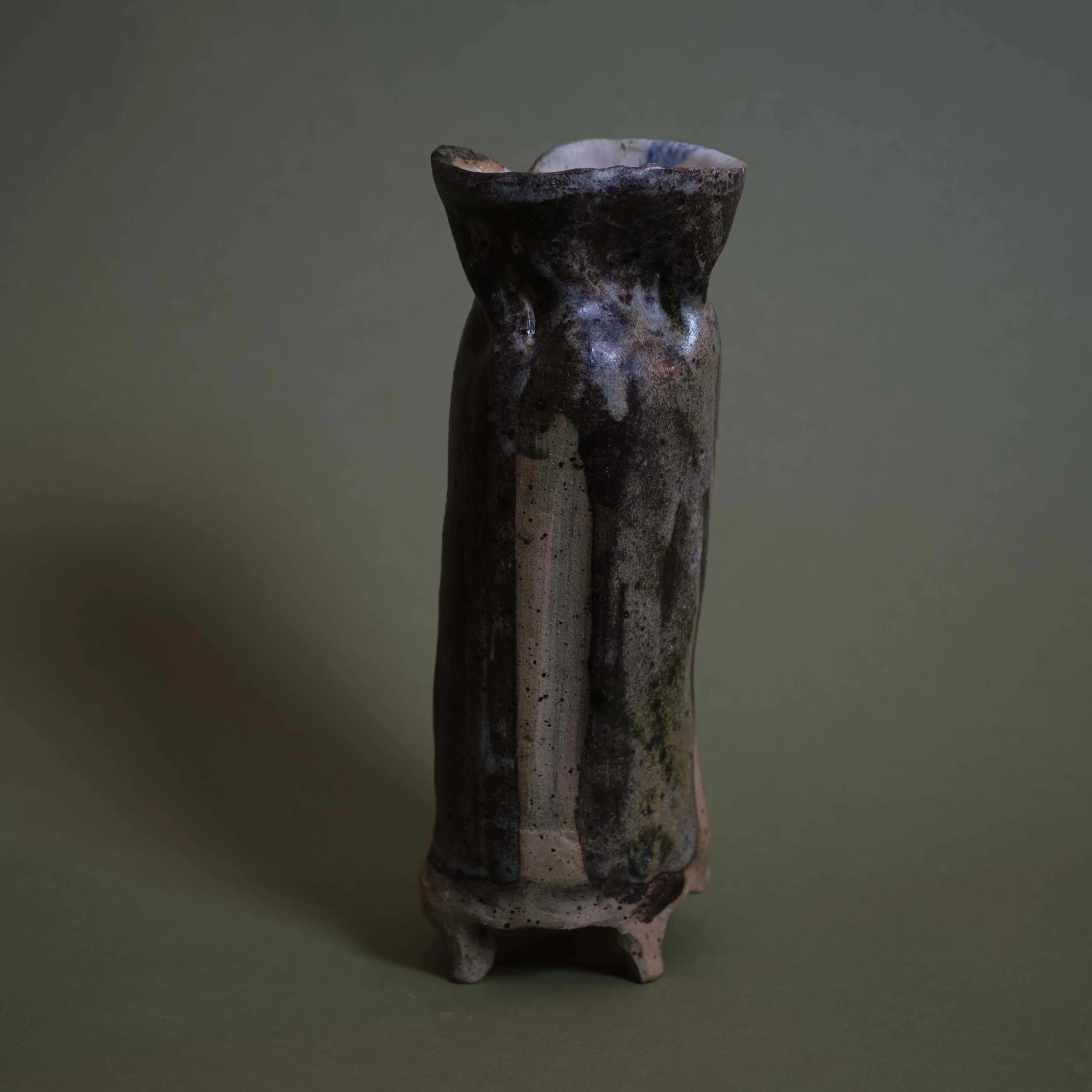 Tall Green Vessel contemporary ceramic piece with organic vertical structure and textured hand-built clay surface