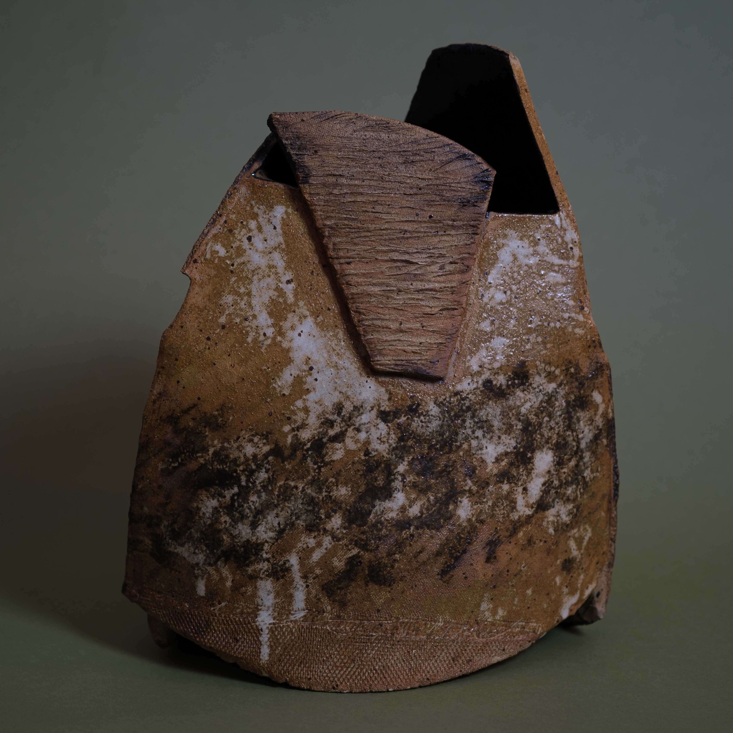 Drifted Shape contemporary ceramic vessel featuring carved geometric planes and raw organic surface detailing