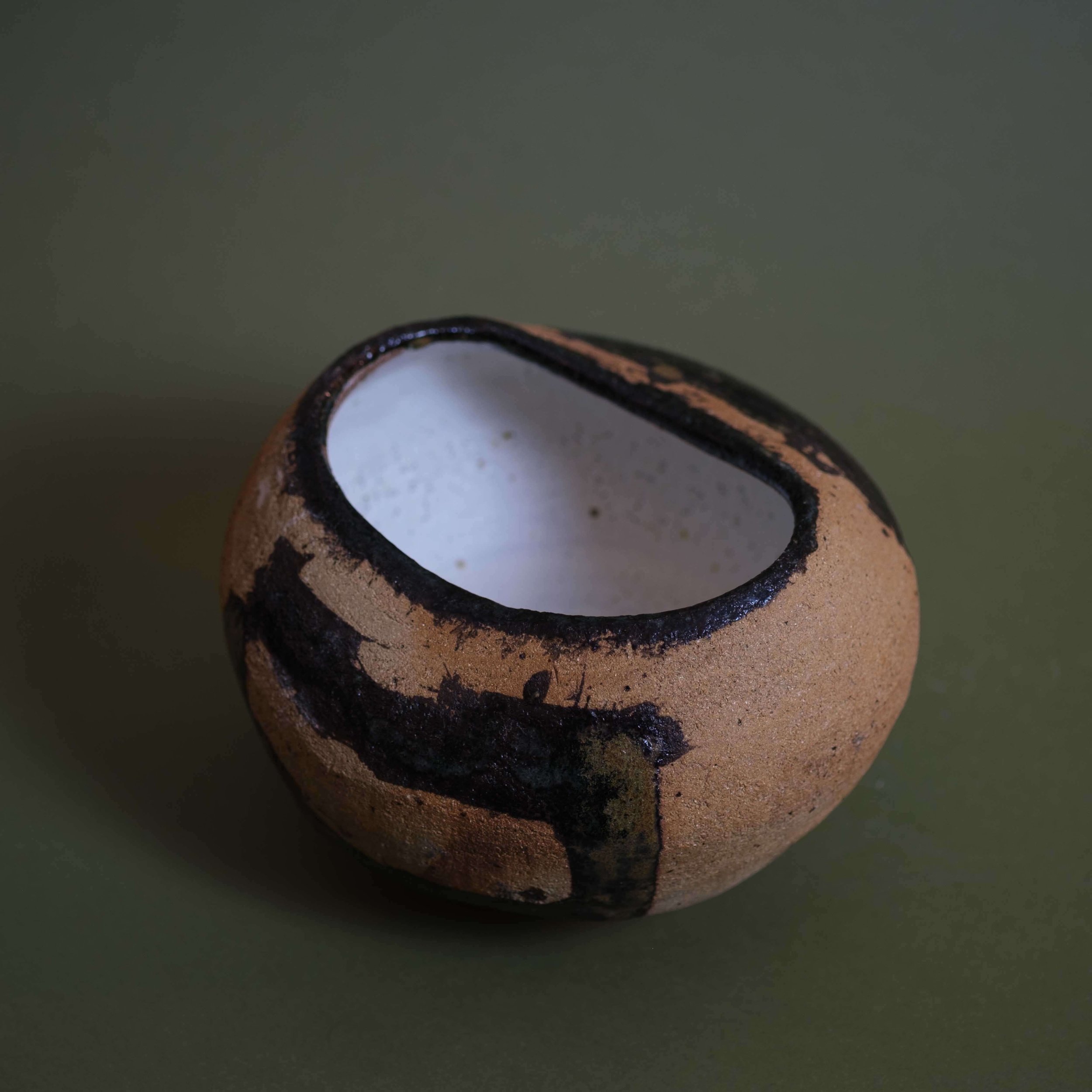 Top view of Trace handmade ceramic artwork showing white glazed interior and hand-built clay structure