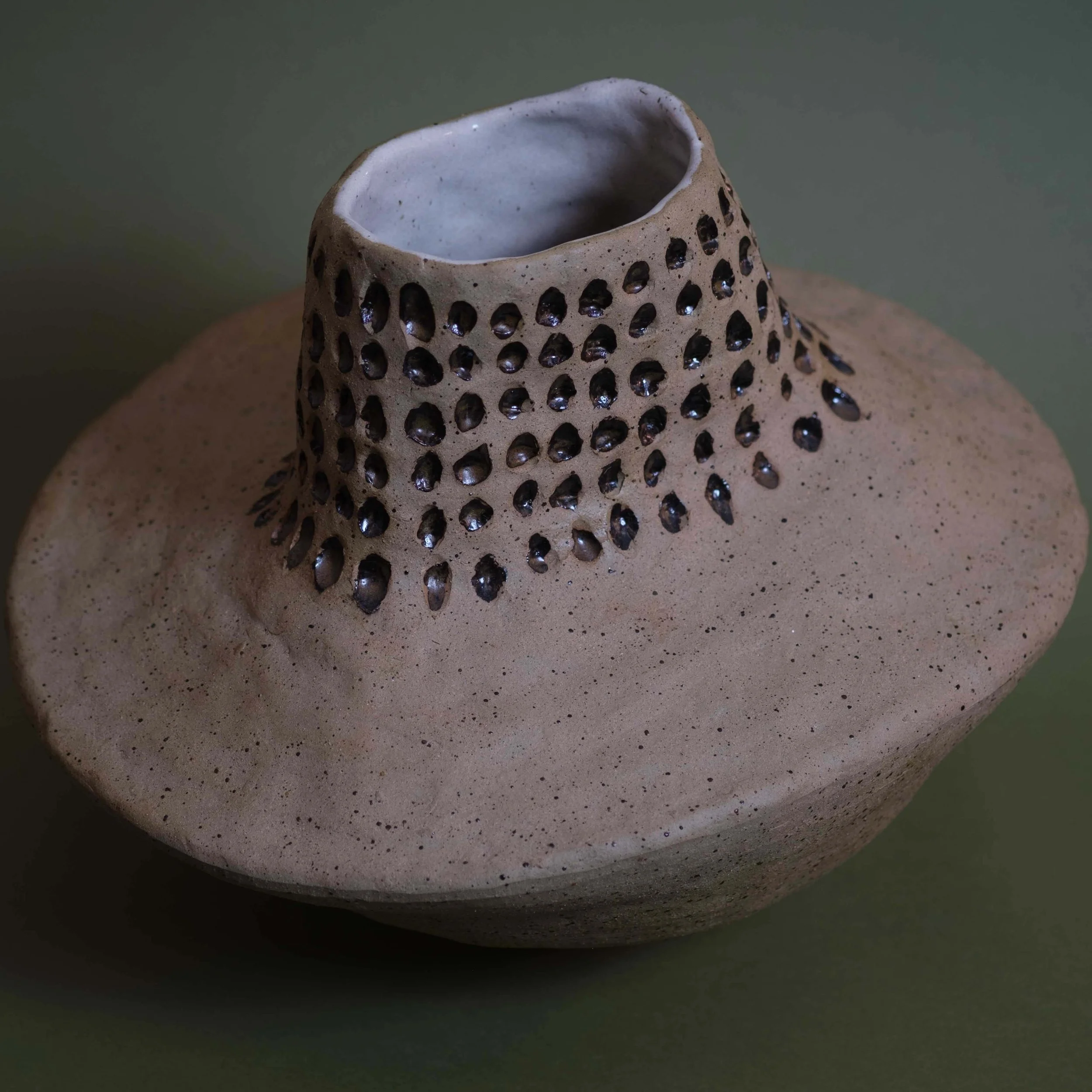 Dip in Space handmade ceramic art piece with rhythmic cut-out pattern and earthy natural clay finish