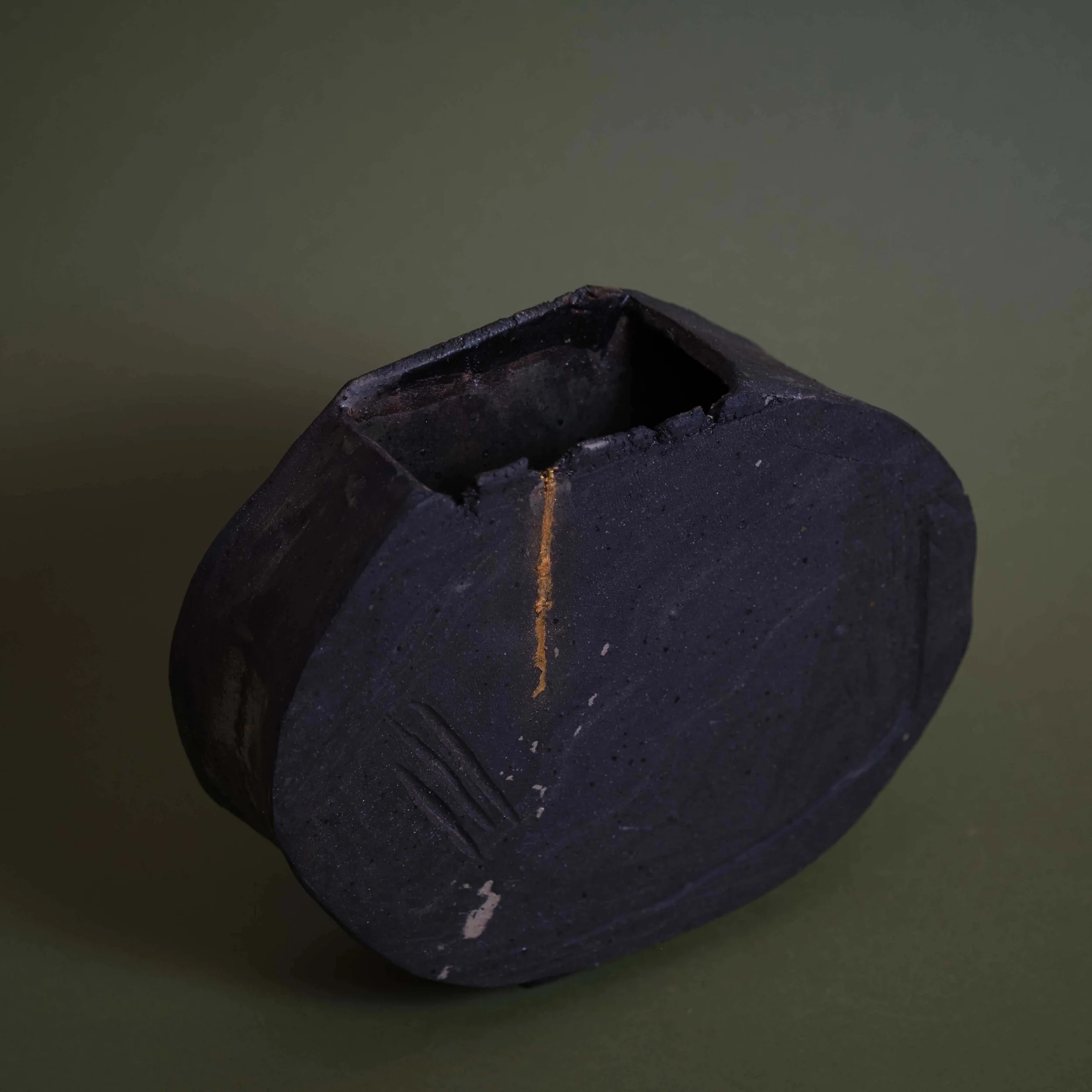 Detail of Dusty Line Vessel handmade ceramic artwork showing carved line patterns and earthy matte glaze