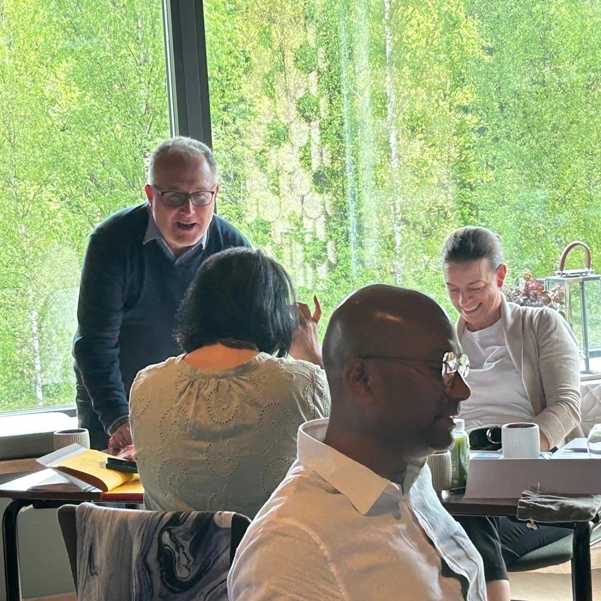 Peter leading a leadership development programme with three delegates engage in an exercise to develop their coaching skills as part of their development. Session part of our Mindful Leadership course.