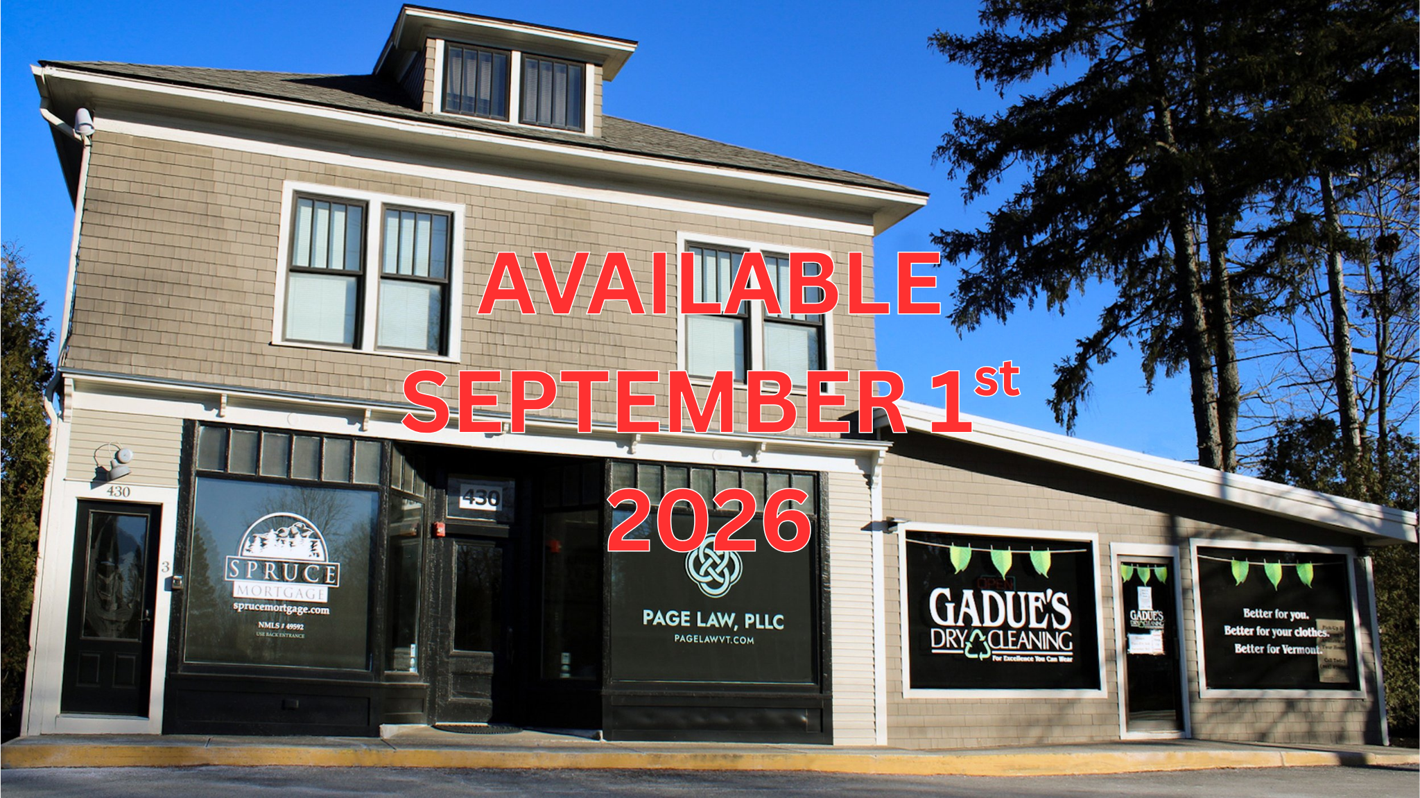 Building with storefronts for Spruce Mortgage, Page Law, and Gadue's Dry Cleaning.