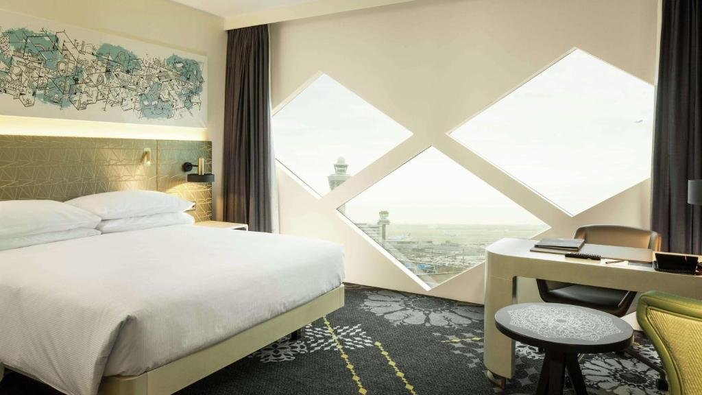 A room at the Hilton with a view of the airport.