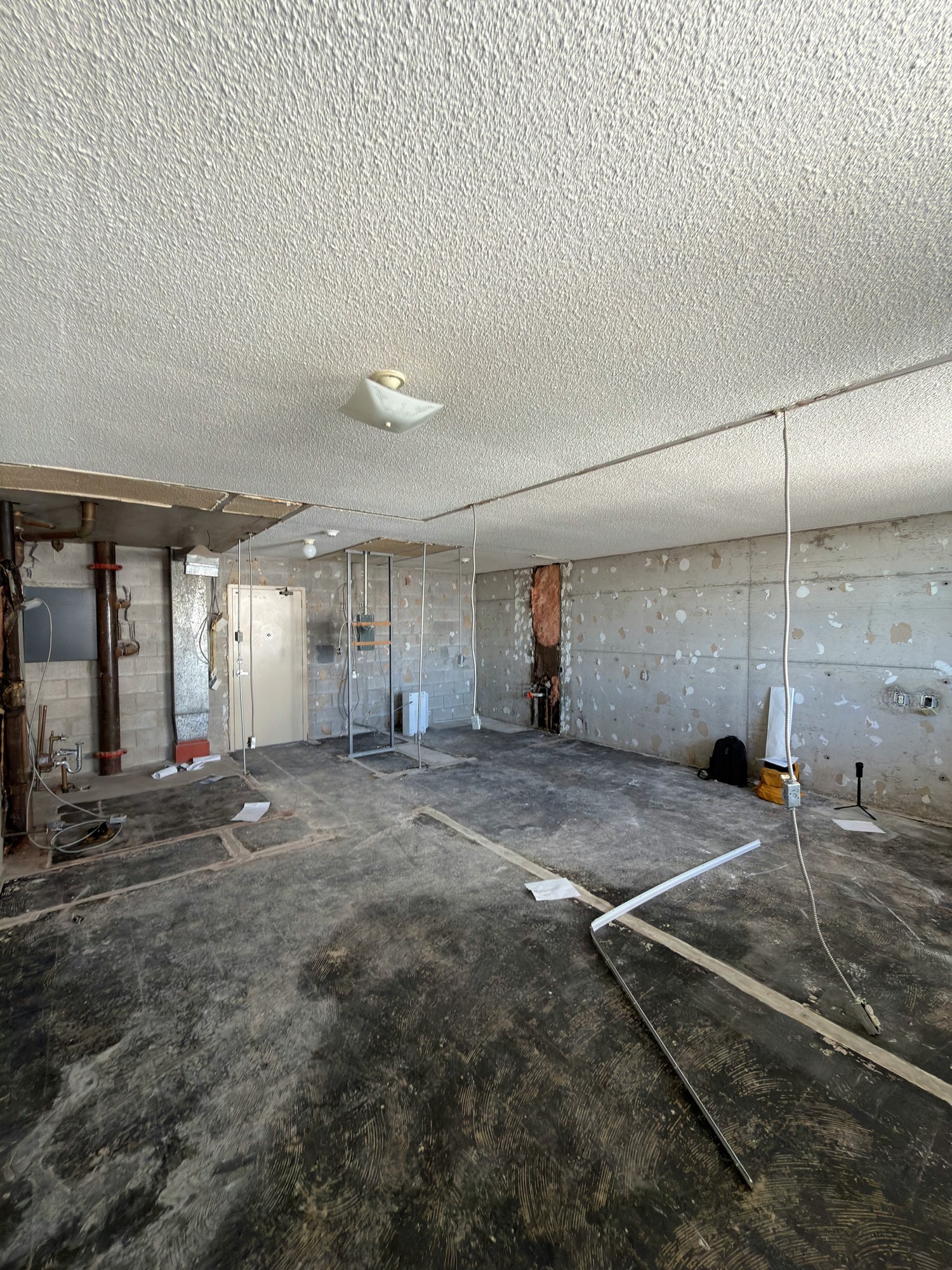 gutted-unit-concrete-block-walls-stripped-floor-windsor-ontario-01.jpg