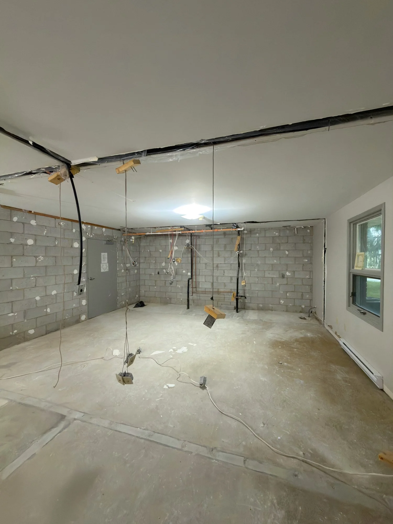 block-wall-hanging-wires-gutted-room-chatham-ontario-01.jpg