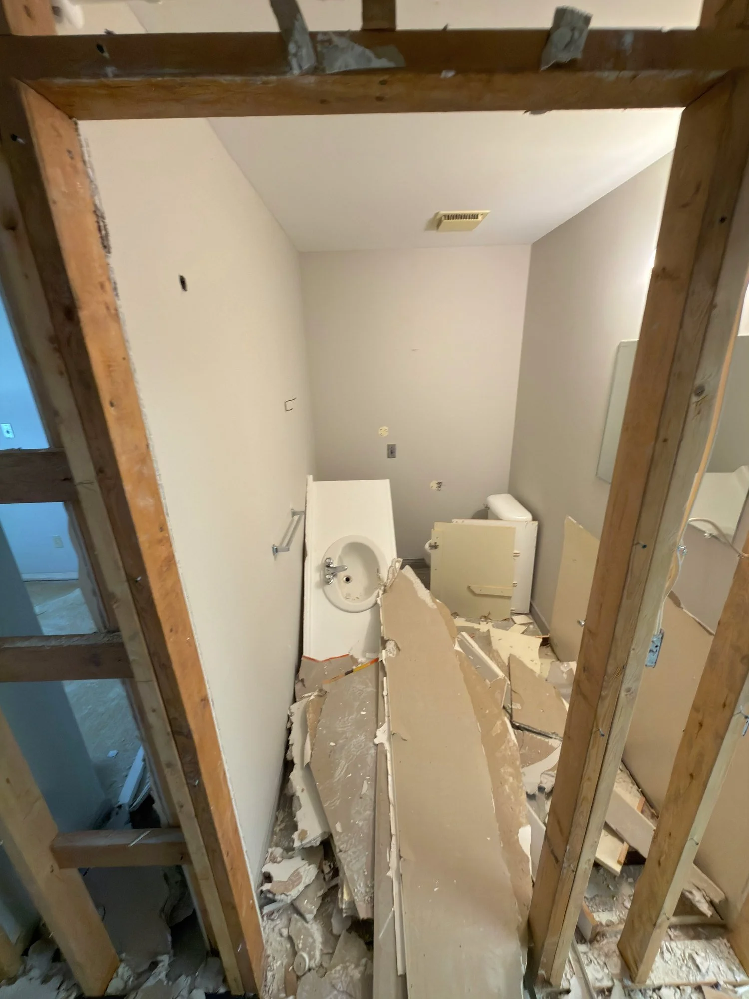 bathroom-partition-demolition-broken-drywall-chatham-ontario-01.jpg