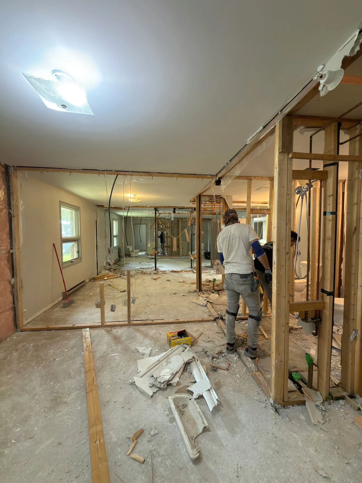 worker-gutting-room-framing-debris-chatham-ontario-01.jpg
